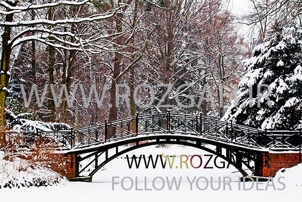Winter scene – Old bridge in winter snowy park
